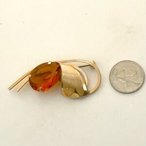 Elegant Gold and Orange Brooch with Leaf Design